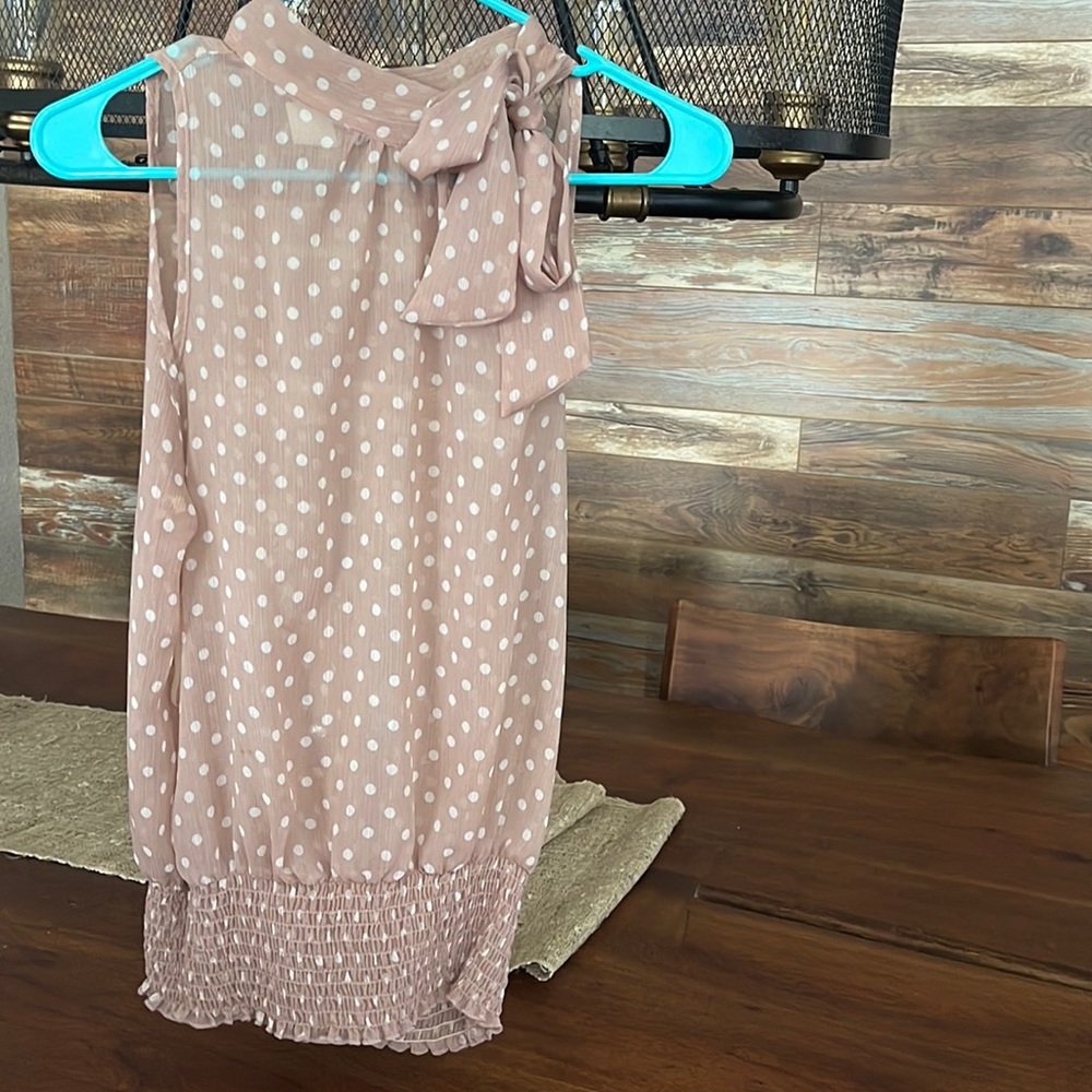 Sleeveless top with side neck bow tie